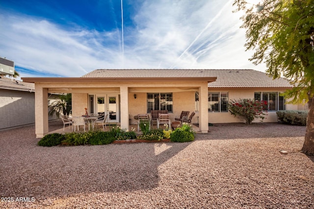 rear view of property with a patio