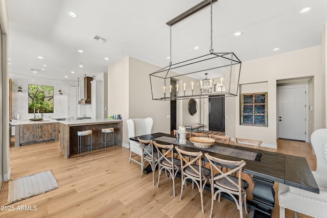 11324 E Diamond Cholla Dr, Scottsdale, AZ 85255 - dining area featuring light wood-style floors, recessed lighting, a chandelier, and baseboards