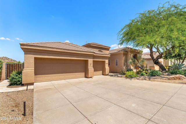 11324 E Diamond Cholla Dr, Scottsdale, AZ 85255 - view of front of property featuring stucco siding, driveway, an attached garage, and a tile roof