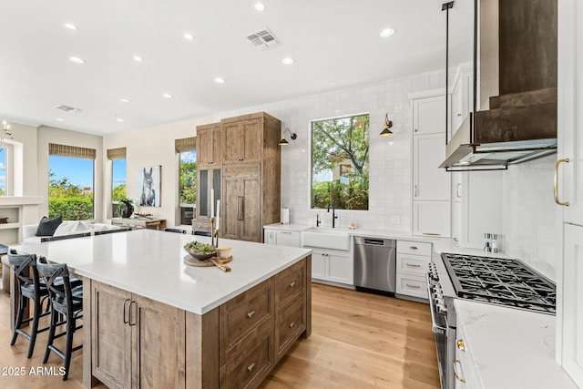 11324 E Diamond Cholla Dr, Scottsdale, AZ 85255 - kitchen featuring appliances with stainless steel finishes, extractor fan, a sink, a spacious island, and recessed lighting