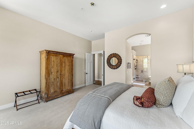11324 E Diamond Cholla Dr, Scottsdale, AZ 85255 - bedroom featuring arched walkways, light carpet, baseboards, and connected bathroom