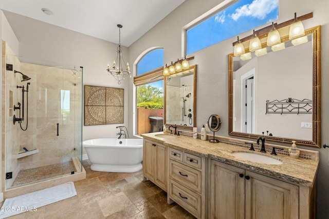 11324 E Diamond Cholla Dr, Scottsdale, AZ 85255 - bathroom with a freestanding tub, a stall shower, double vanity, a chandelier, and stone finish floors