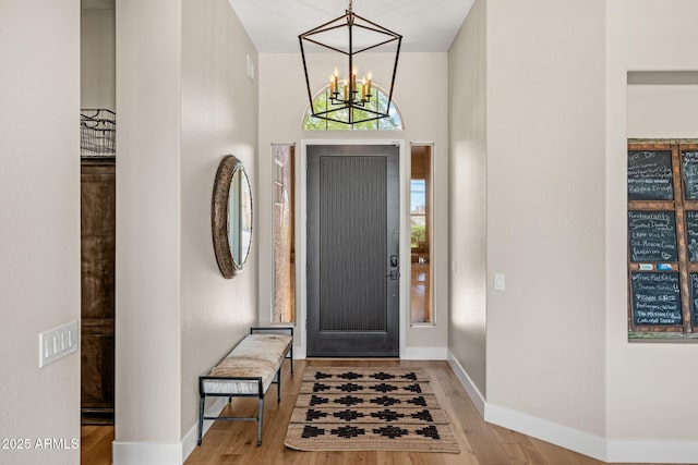 11324 E Diamond Cholla Dr, Scottsdale, AZ 85255 - entrance foyer featuring a chandelier, wood finished floors, and baseboards