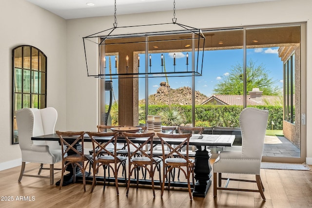 11324 E Diamond Cholla Dr, Scottsdale, AZ 85255 - dining area featuring wood finished floors, healthy amount of natural light, and baseboards