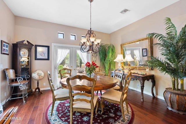 dining room featuring a chandelier, french doors, and dark hardwood / wood-style flooring