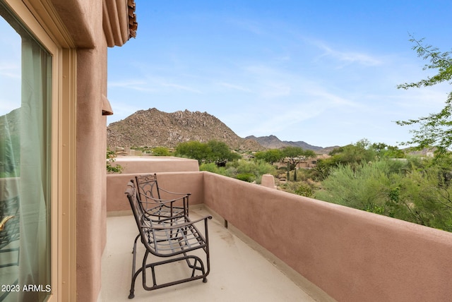 balcony featuring a mountain view