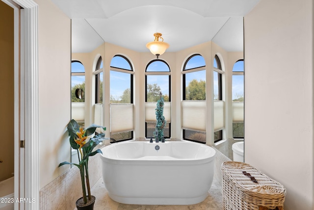 bathroom featuring a bathing tub and tile patterned flooring