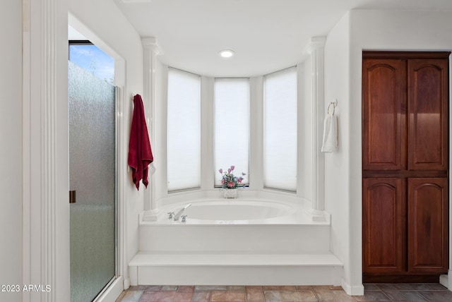 bathroom featuring plus walk in shower