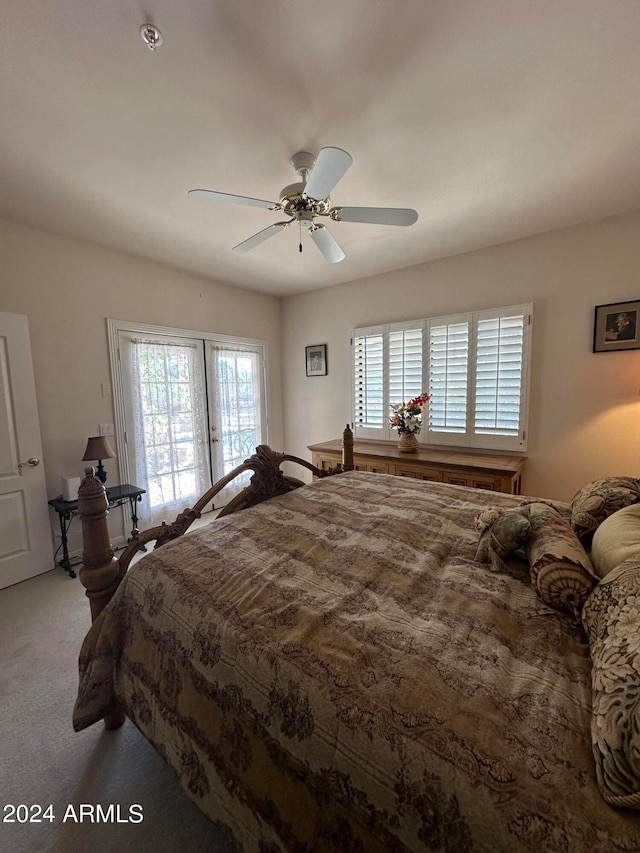 bedroom with ceiling fan and carpet