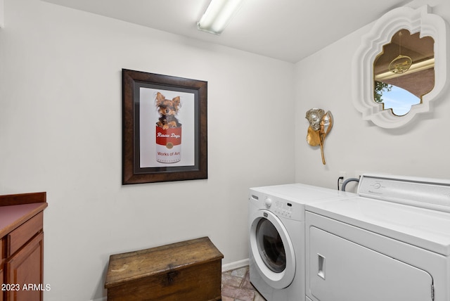 laundry area with cabinets and separate washer and dryer