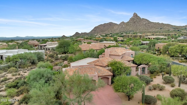 birds eye view of property featuring a mountain view