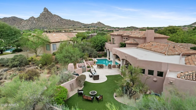 birds eye view of property with a mountain view