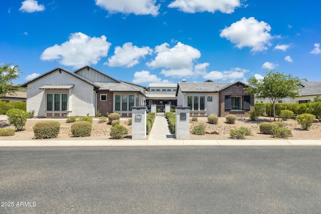 2630 E Lovebird Ln, Gilbert, AZ 85297 - view of front of house with brick siding, stucco siding, and board and batten siding