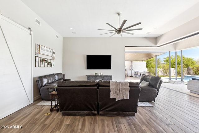 2630 E Lovebird Ln, Gilbert, AZ 85297 - living area featuring a ceiling fan, wood finished floors, and a barn door