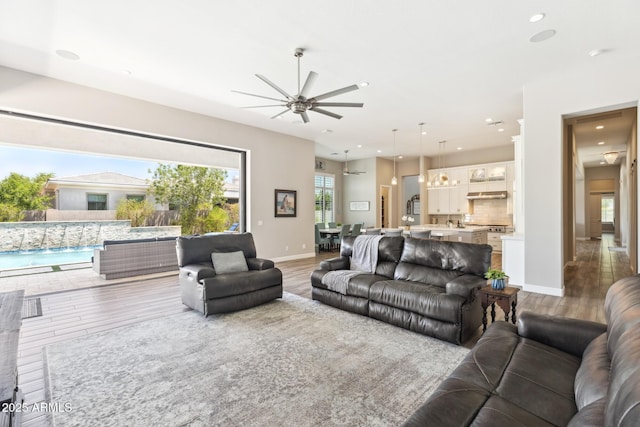 2630 E Lovebird Ln, Gilbert, AZ 85297 - living room with wood finished floors, ceiling fan, and recessed lighting