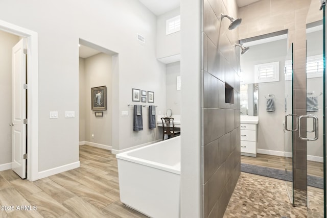 2630 E Lovebird Ln, Gilbert, AZ 85297 - hall featuring light wood-style floors, plenty of natural light, and a towering ceiling