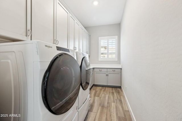 2630 E Lovebird Ln, Gilbert, AZ 85297 - washroom featuring independent washer and dryer, cabinet space, and light wood-type flooring