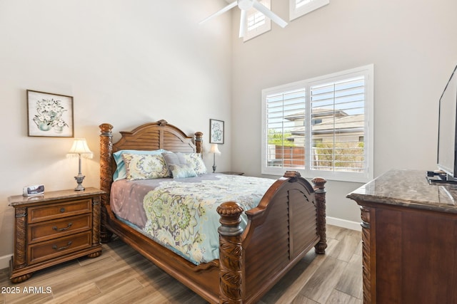 2630 E Lovebird Ln, Gilbert, AZ 85297 - bedroom featuring light wood-style flooring and a towering ceiling