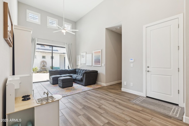 2630 E Lovebird Ln, Gilbert, AZ 85297 - living room featuring high vaulted ceiling, light wood finished floors, and ceiling fan