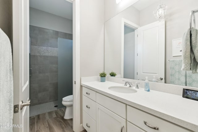 2630 E Lovebird Ln, Gilbert, AZ 85297 - bathroom featuring vanity, a shower stall, wood finished floors, and a chandelier