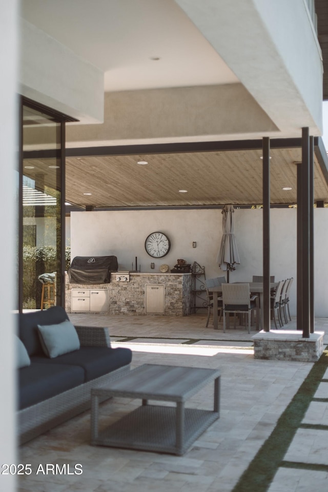 2630 E Lovebird Ln, Gilbert, AZ 85297 - view of patio / terrace with exterior kitchen and outdoor dining area