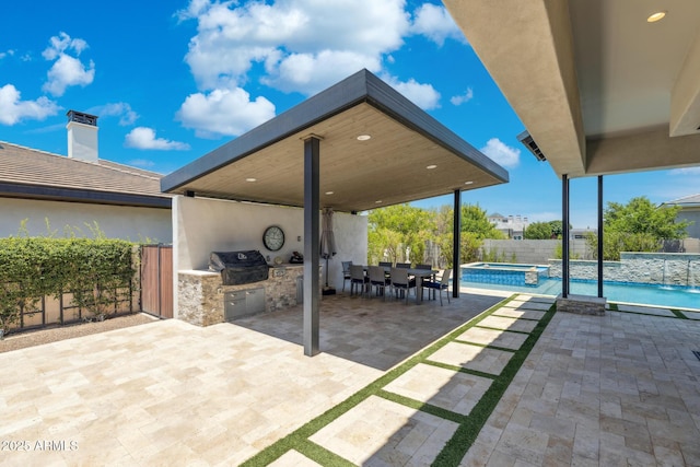 2630 E Lovebird Ln, Gilbert, AZ 85297 - fenced backyard featuring area for grilling, a patio, a pool with connected hot tub, and outdoor dining space