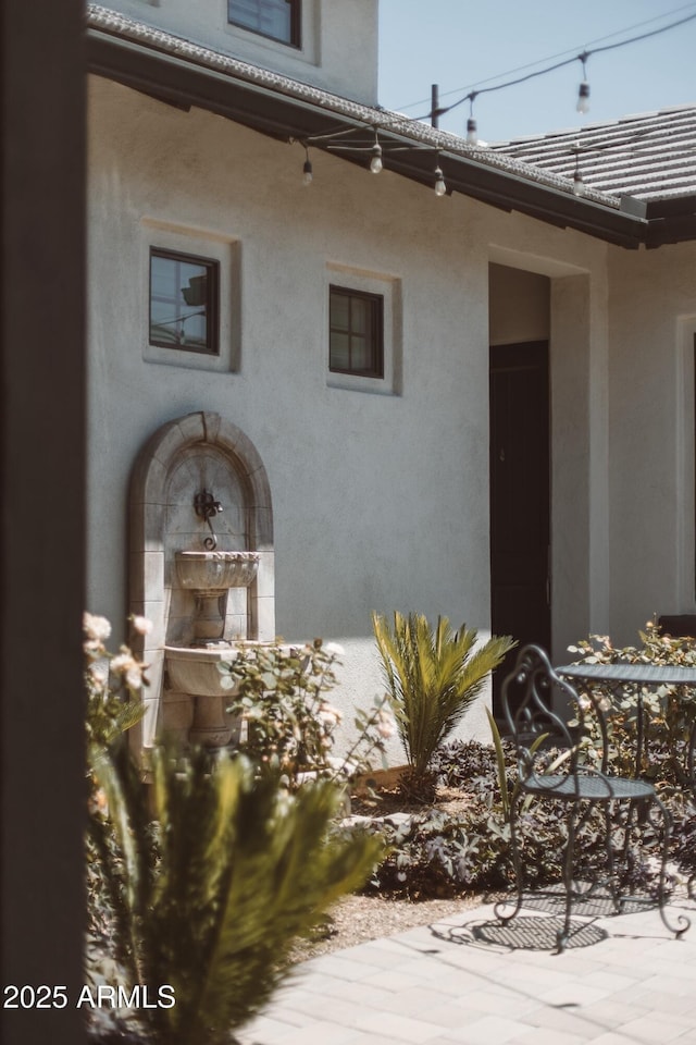 2630 E Lovebird Ln, Gilbert, AZ 85297 - view of exterior entry featuring stucco siding and a tiled roof