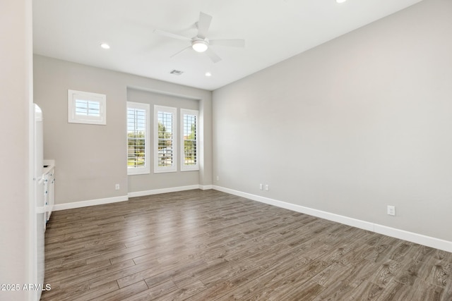 2630 E Lovebird Ln, Gilbert, AZ 85297 - spare room with wood finished floors, ceiling fan, and recessed lighting