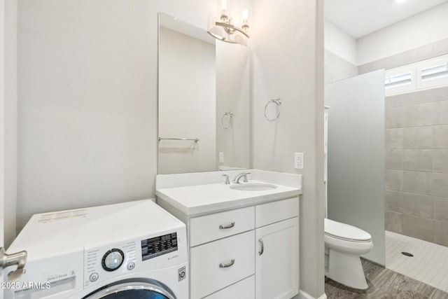 2630 E Lovebird Ln, Gilbert, AZ 85297 - bathroom featuring washer / clothes dryer, tiled shower, and vanity