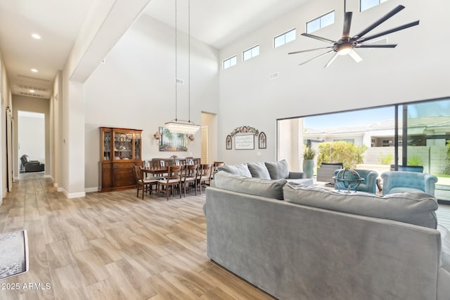 2630 E Lovebird Ln, Gilbert, AZ 85297 - living area featuring a ceiling fan, light wood finished floors, recessed lighting, and a towering ceiling
