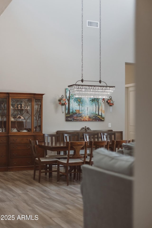 2630 E Lovebird Ln, Gilbert, AZ 85297 - dining space with a high ceiling and light wood-type flooring