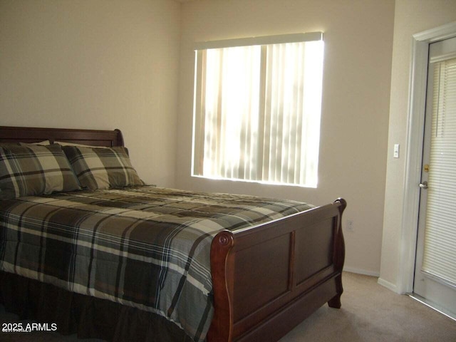 carpeted bedroom with baseboards