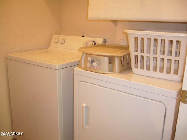 washroom with washer and dryer and laundry area