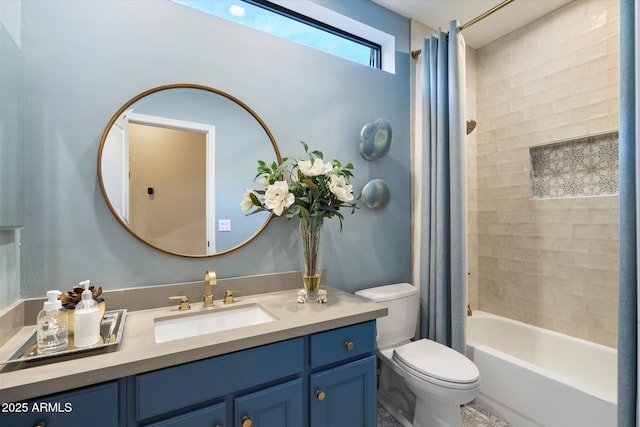 full bathroom with vanity, shower / tub combo, and toilet