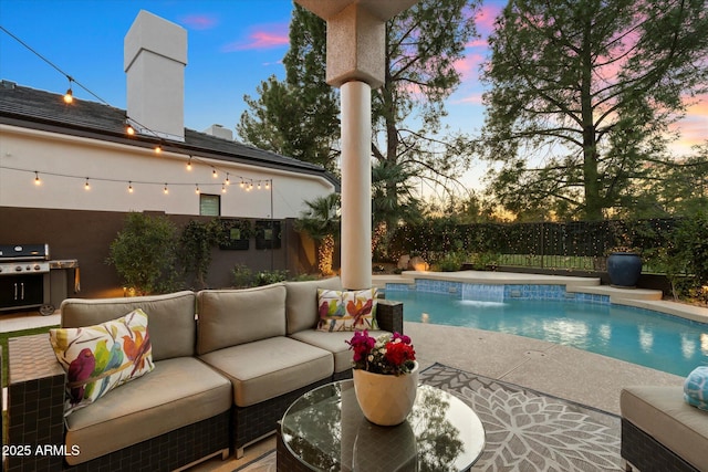 pool at dusk featuring an outdoor living space, a grill, and a patio area