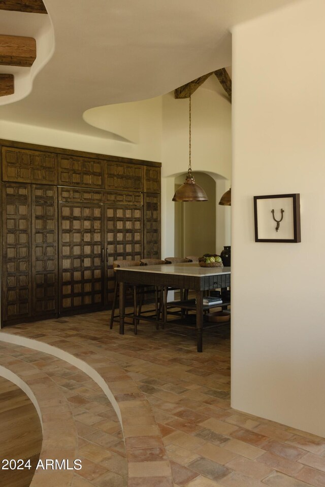 dining space featuring a high ceiling