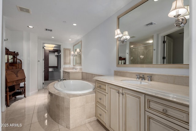 bathroom with tile patterned floors, visible vents, a bath, and a shower stall