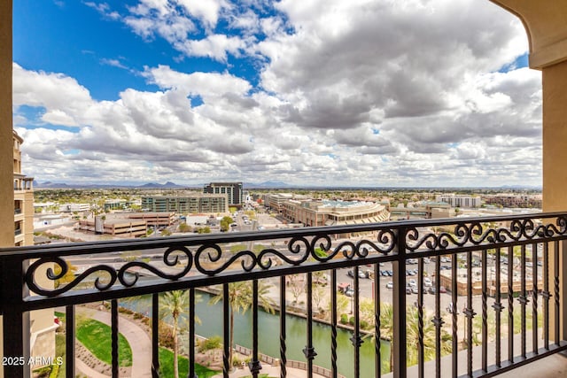 balcony with a view of city and a water view