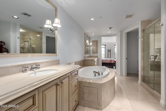 full bathroom featuring visible vents, a stall shower, vanity, and a bath