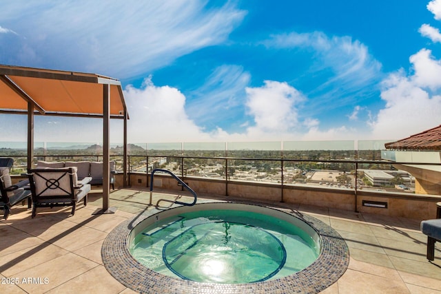 view of pool featuring an outdoor living space, an in ground hot tub, and a patio area