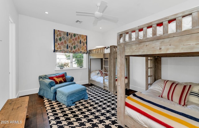 bedroom with ceiling fan and dark hardwood / wood-style floors