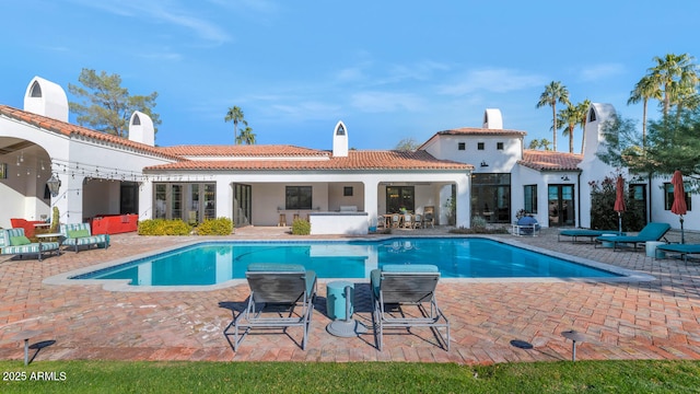 rear view of house featuring a patio