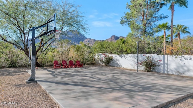 view of sport court with a mountain view