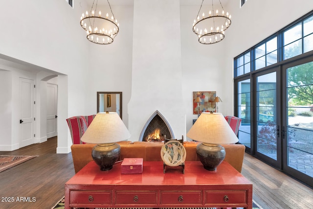 details featuring a chandelier, hardwood / wood-style floors, and french doors