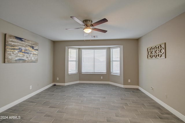 spare room with ceiling fan