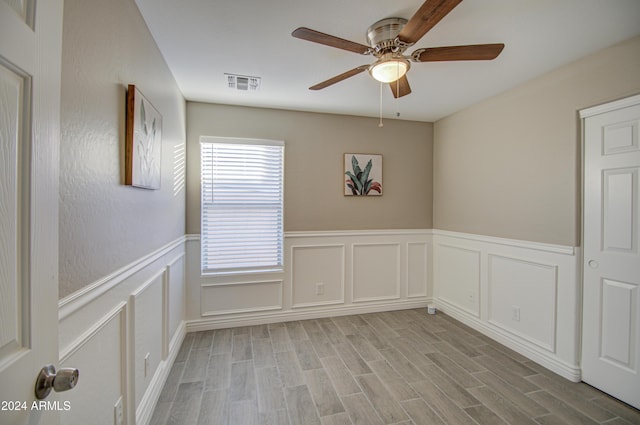 unfurnished room with ceiling fan and light hardwood / wood-style flooring