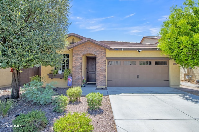 view of front of property with a garage