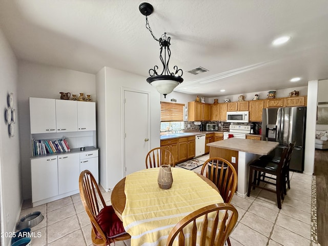 1758 E San Xavier Dr, Casa Grande, AZ 85122 - dining space with light tile patterned flooring and recessed lighting