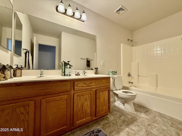 1758 E San Xavier Dr, Casa Grande, AZ 85122 - full bath with double vanity, toilet, shower / tub combination, and a textured wall