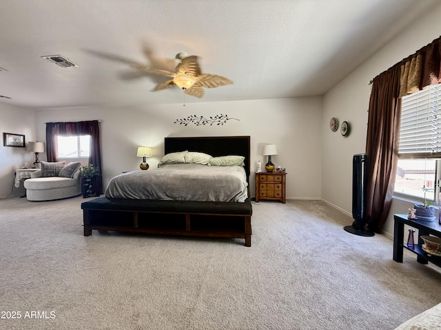 1758 E San Xavier Dr, Casa Grande, AZ 85122 - bedroom with carpet, multiple windows, ceiling fan, and baseboards